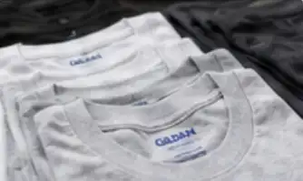 Plain grey and white T-shirts laid out together